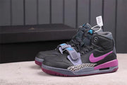 Pair of dark grey and purple high-top Jordan sneakers shown from a three-quarter front angle.