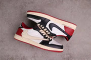 Overhead angled view of the pair showing contrasting side panels and red outsoles.
