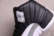 Close-up of the black textured upper, translucent side eyelet, and grey Jumpman panel.