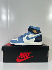Side profile of a high-top sneaker with blue overlays and dark navy heel