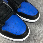 Close-up of the perforated blue toe panels with multicolor speckled detailing.