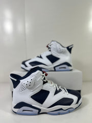 Side view showing the perforated upper panels, high collar, visible heel cushioning, and translucent outsole.