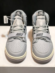 Front view of the pair showing Nike tongue labels, perforated toe boxes and adjustable straps.