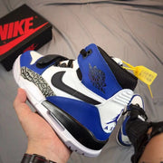 Close rear-side view showing the blue collar, white heel panel, black detailing, and Air Jordan-style heel graphic.