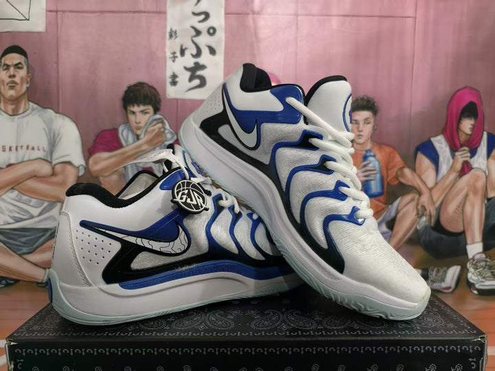 Pair of white and blue Nike basketball shoes shown from the side on a box.