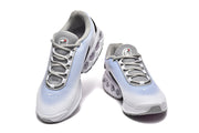 Top view of the pair of Nike Air Max DN sneakers showing the lacing and gray lining.