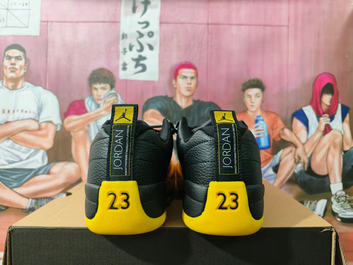 Rear view of black and yellow Jordan sneakers showing heel tabs and number 23 details