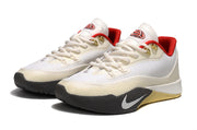 Pair of cream Nike S.T. Flare EP shoes with red details.