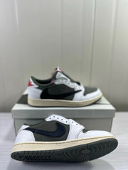 Low-top sneakers shown from the side and underside, highlighting the dark outsole tread.