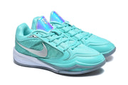 Aqua Nike basketball shoes with silver Swooshes and iridescent tongue panels, shown from the side.