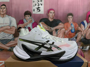 Side view of a white ASICS METARISE shoe with black and yellow-green detailing.