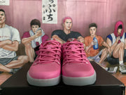 Front view of the pink Nike basketball sneakers showing the mesh-textured uppers, pink laces, and padded collars.