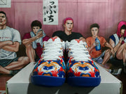 Front view showing the patterned toe boxes, white laces, padded tongues, and blue rubber outsoles.