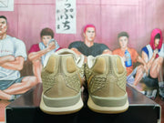 Rear view of olive and cream Nike Kobe basketball shoes