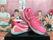 Pink Nike Kobe basketball shoes shown from an angled side view