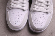 Top-down close-up showing the perforated white toe boxes and white laces.