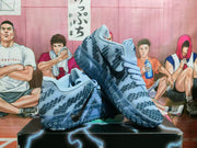 Cobalt blue Nike sneakers arranged on a shoebox to show the side profile, patterned upper and textured outsole.