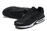 Black Nike Air Max sneakers shown from an angled top and side view.