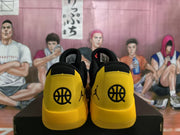 Rear view showing yellow heel panels with basketball-themed and Jordan branding.