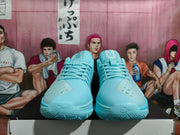 Front view of the blue Nike basketball shoes showing the laces, toe panels and tongue markings.