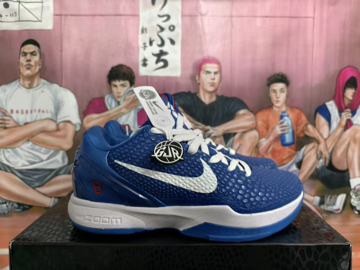 Side view of blue and white Nike basketball sneakers with a textured upper, white Swoosh, white laces, and red heel detailing.