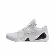 Side view of a predominantly white Nike Kobe 9 basketball shoe with a textured upper, white Swoosh, and dark geometric midsole panels.