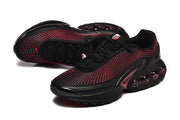 Angled view of black and red lace-up sneakers