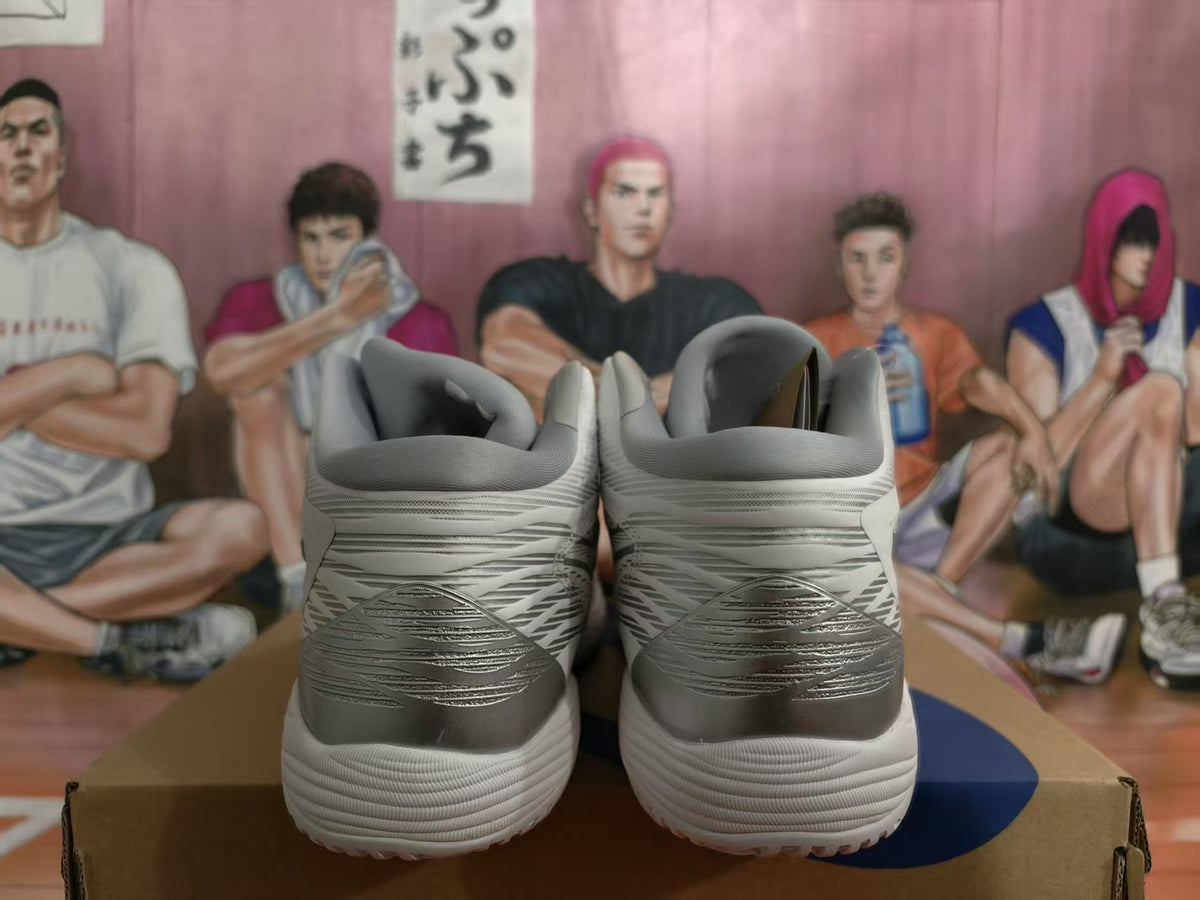 Rear view of white and silver-gray ASICS basketball shoes