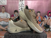 Angled view of the pair showing the beige and cream upper, black collar trim, lace-up construction, side logos, and sculpted outsole.