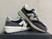 Angled view of the New Balance U370 sneakers showing the side logo and chunky midsole