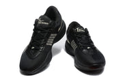 Pair of black Nike basketball sneakers shown from a front three-quarter angle with light-colored Swoosh accents.