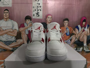Front view of white high-top sneakers with red tongue logos and lace details
