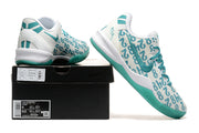 White and teal Kobe 8 Protro shoes displayed with a shoe box.