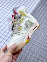 Side view showing the translucent panel, circular side detail, gray laces, and yellow accents.