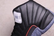 Close-up of the black stitched upper, translucent side detail and red-edged trim.