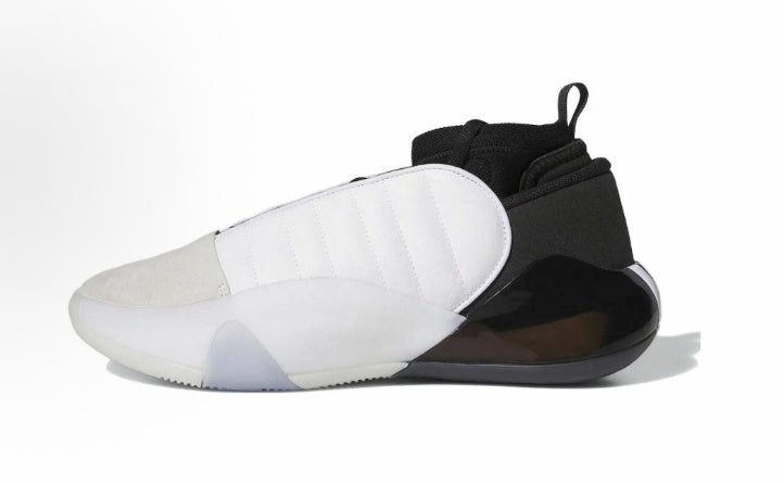 Cloud-white and black low-top sneaker shown from the side on a white background.