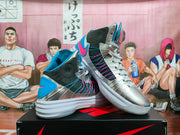 Pair of silver Nike basketball sneakers shown from angled side and front views, featuring blue and pink details.