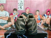 Rear view of brown and black Nike basketball sneakers showing patterned uppers, padded collars, and textured black outsoles.