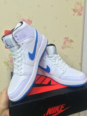 Pair of white and blue high-top sneakers arranged on a shoebox.