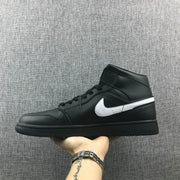 Opposite side profile showing the black upper, white Swoosh and black rubber outsole.