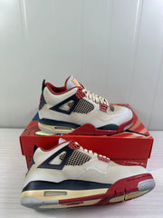 Detailed angled view of the Jordan Air Jordan 4 Retro pair, highlighting the mesh panels, lace supports, and outsole.