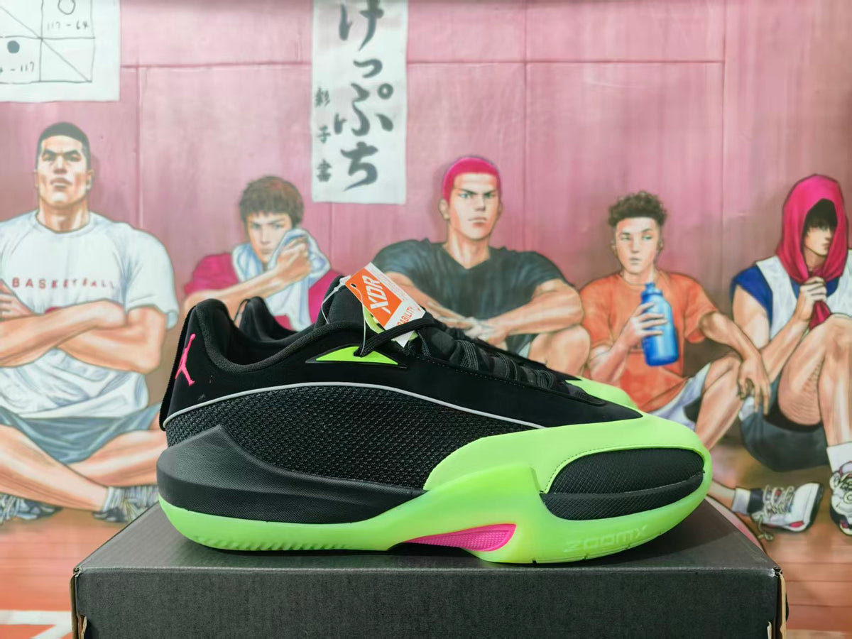 Side view of black Jordan Luka 1 basketball shoes with bright green and pink accents