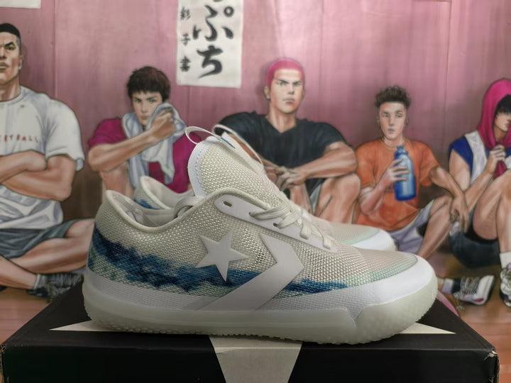 Side view of white Converse-style sneakers with a blue wave-like stripe, star-and-chevron side branding, and textured uppers.