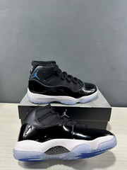 Angled view of two black and blue high-top sneakers showing the glossy uppers and translucent outsoles.