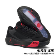 Black and red Jordan 8812 basketball shoes shown with a black patterned outsole.