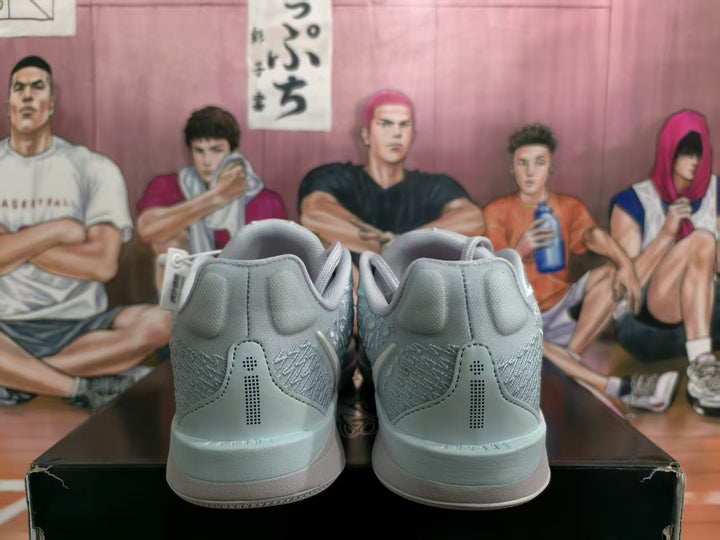 Rear view of light blue Nike basketball shoes showing the heel details and textured panels.