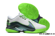 White, black, and bright green Nike LeBron 22 sneakers with vivid green outsoles.