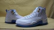 Front three-quarter view of the pair with white uppers and blue soles.