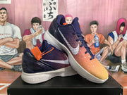Angled view of the Nike basketball sneakers displaying the textured gradient upper, white Swoosh, and white midsoles.