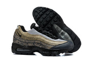 Nike Air Max 95 TT sneakers showing patterned sides and black tread outsole.